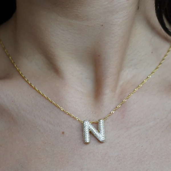 The Singapore chain, worn with the N